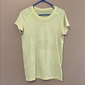 Sort neon yellow green Lululemon tech shirt.